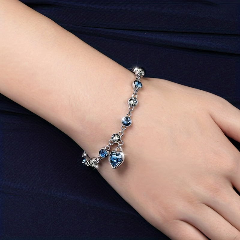 Heart of Ocean Bracelet – worn on wrist showing heart charm and blue crystals, romantic lifestyle