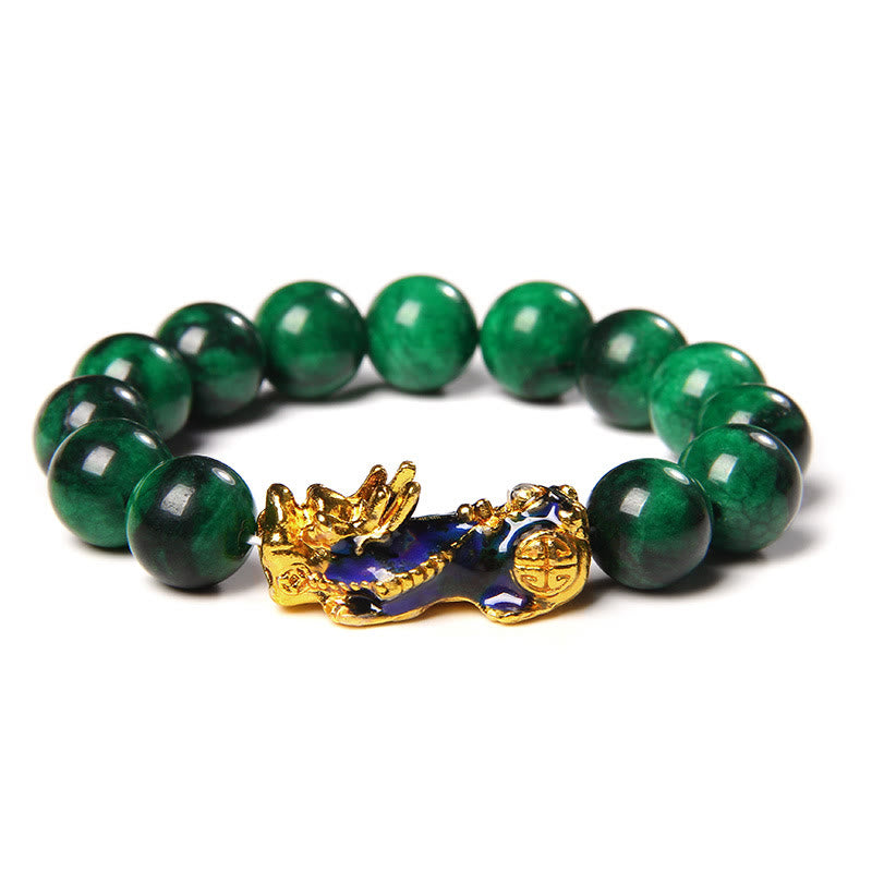 Jade Pixiu Bracelet – Green jade beads with gold-blue enamel PiXiu charm on white background, wealth feng shui jewelry