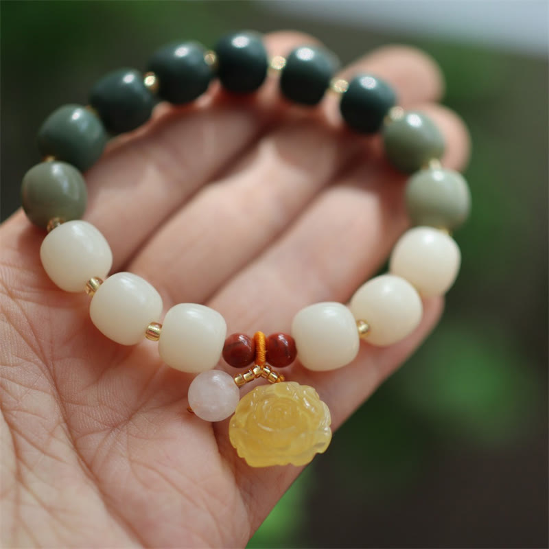 Gradient Bodhi Seed Amber Lotus Bracelet – green-to-cream ombré beads with carved amber lotus on palm, Serene