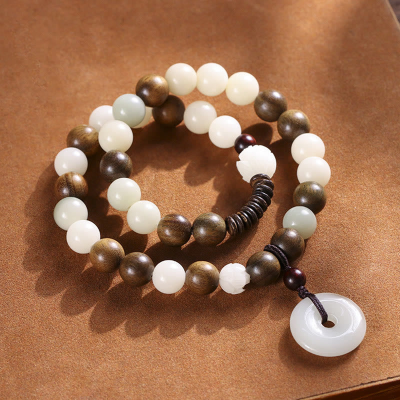 Bodhi Seed Sandalwood Lotus Bracelet - white jade and sandalwood beads with lotus carving, kraft paper
