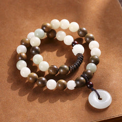 Bodhi Seed Sandalwood Lotus Bracelet - white jade and sandalwood beads with lotus carving, kraft paper