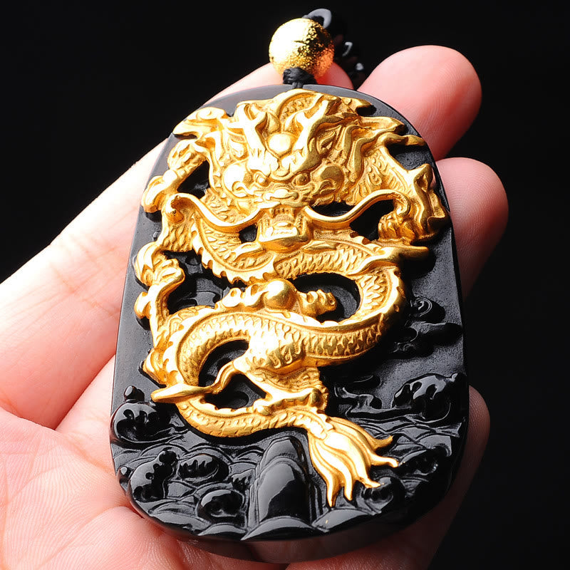 18K Gold Dragon Obsidian Lucky Pendant Necklace – Gold dragon pendant held in hand showing carved scales, lucky