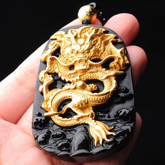 18K Gold Dragon Obsidian Lucky Pendant Necklace – Gold dragon pendant held in hand showing carved scales, lucky