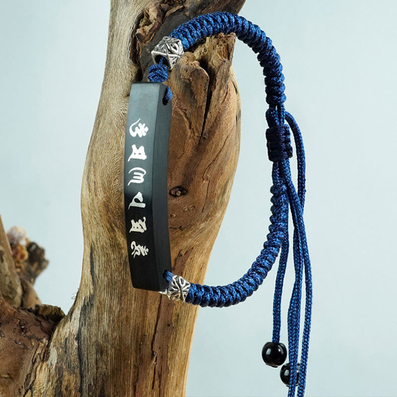 Silver Inlaid Mantra Bracelet – Side angle on weathered driftwood, blue macrame cord with beads