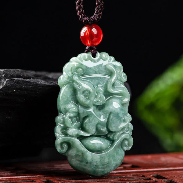 Jade Zodiac Prosperity Necklace – Rabbit zodiac carving on stone and wood, calm presence, serene