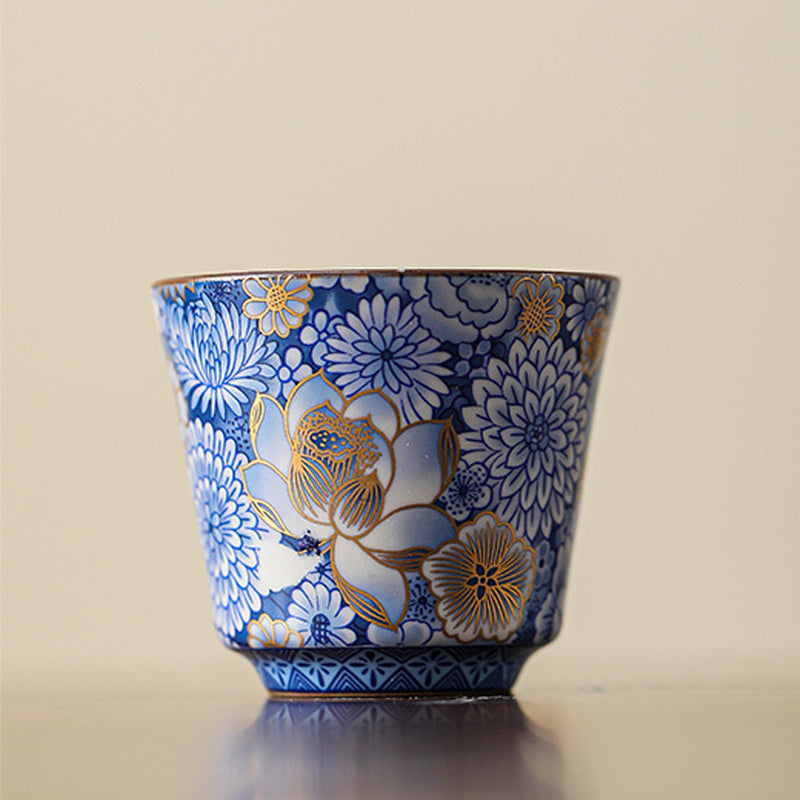 Lotus Chrysanthemum Ceramic Tea Cup - Frontal view with cobalt lotus and gold rim, elegant form