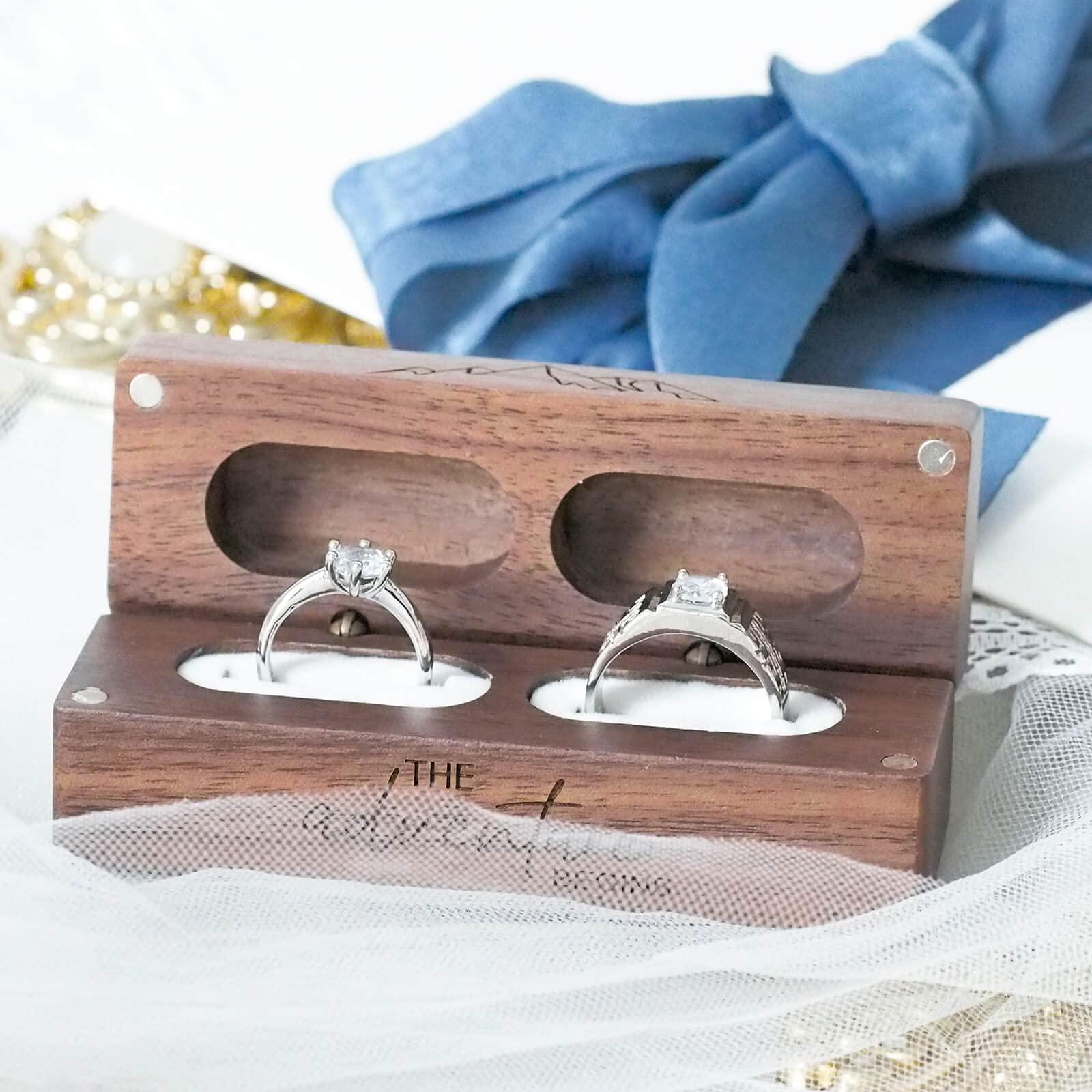 Engraved Walnut Ring Box – diamond rings on white lace with blue satin ribbon, magnetic closure detail
