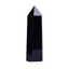 Polished black obsidian crystal point tower, single hexagonal pillar on white background, protection energy shield stone