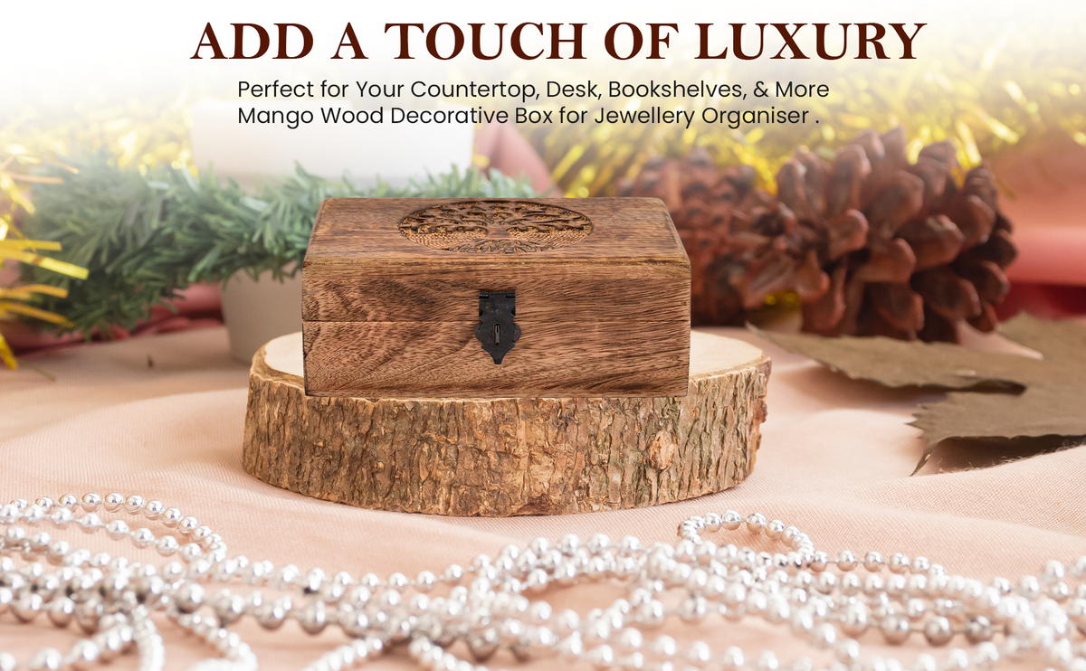 Mango Wood Tree of Life Box – displayed on wood slice with pearls and festive greenery, luxury gift