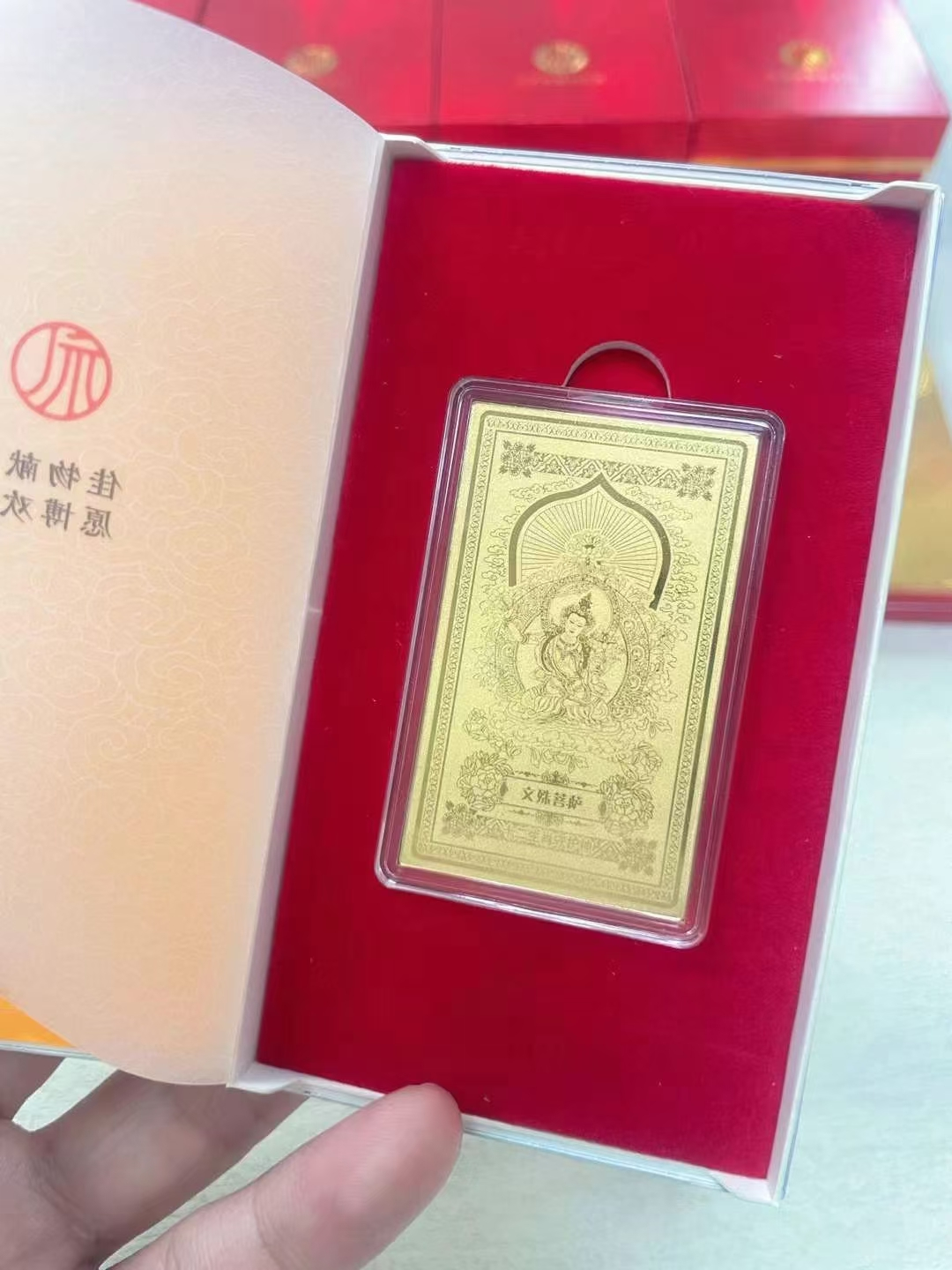 Guardian Gods Gold Foil Phone Sticker – Manjushri Bodhisattva gold foil card in open red velvet gift box, zodiac guardian collection packaging display