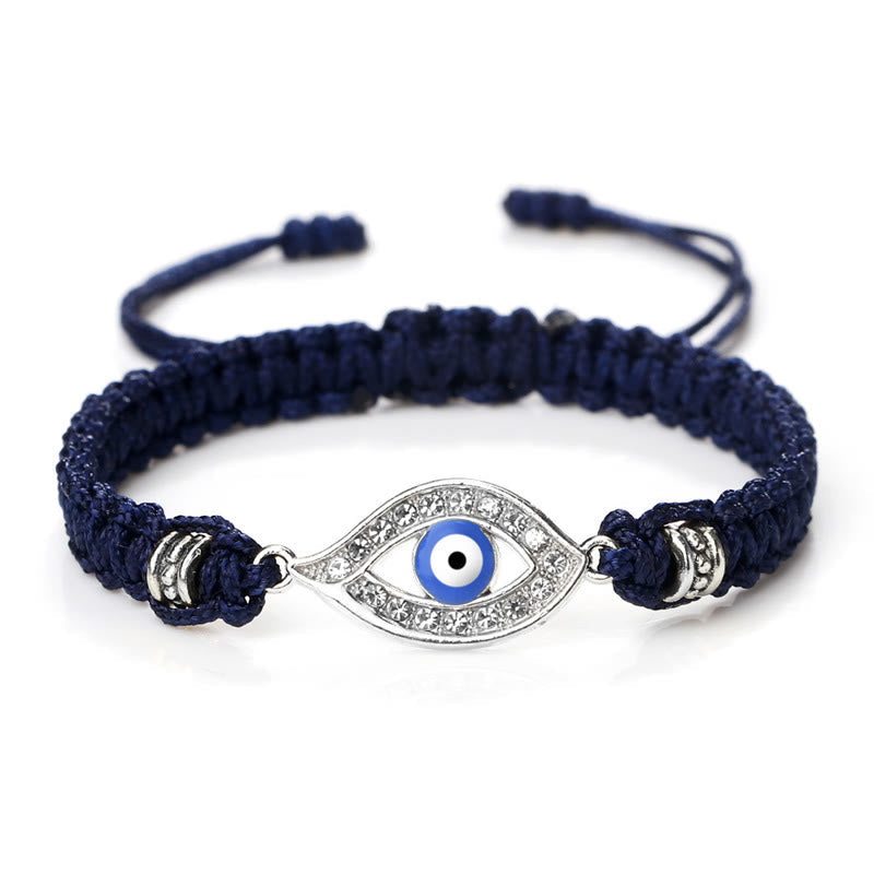Navy blue cord evil eye bracelet with silver blue evil eye crystal charm on white bg