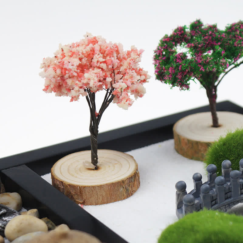 Buddha Zen Garden Decoration - Close-up pink and purple decorative trees on wood slices, zen garden detail