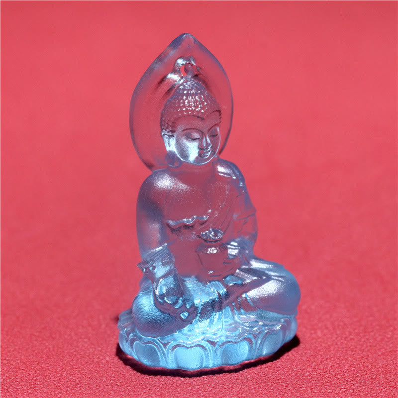 Blue Tathagata Medicine Buddha Liuli Crystal Necklace – three-quarter view of seated Buddha with flame aureole and medicine bowl, coral-red background contrast