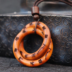 Qiankun Circle Necklace – Two interlocking wooden rings with carved Chinese characters and Big Dipper constellation engraving
