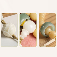 Bodhi Seed Lotus Dzi Bracelet - Macro detail of carved white lotus bead and jade ring spacer, bodhi mala