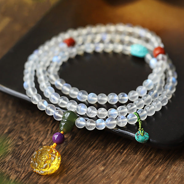 Moonstone Amber Turquoise Lotus Mala - Moonstone mala bracelet with amber pendant and green tassel, artisan
