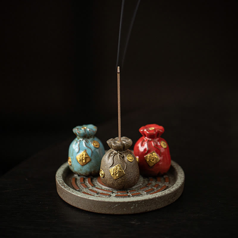 Fortune Bag Incense Holder – Brown ceramic money bag with gold coins and wealth character, incense smoke