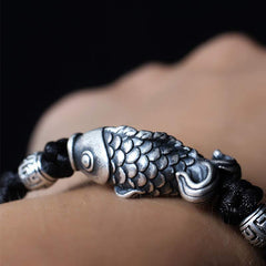 999 Silver Koi Fish Red String Bracelet – worn on wrist lifestyle shot, red string good luck charm
