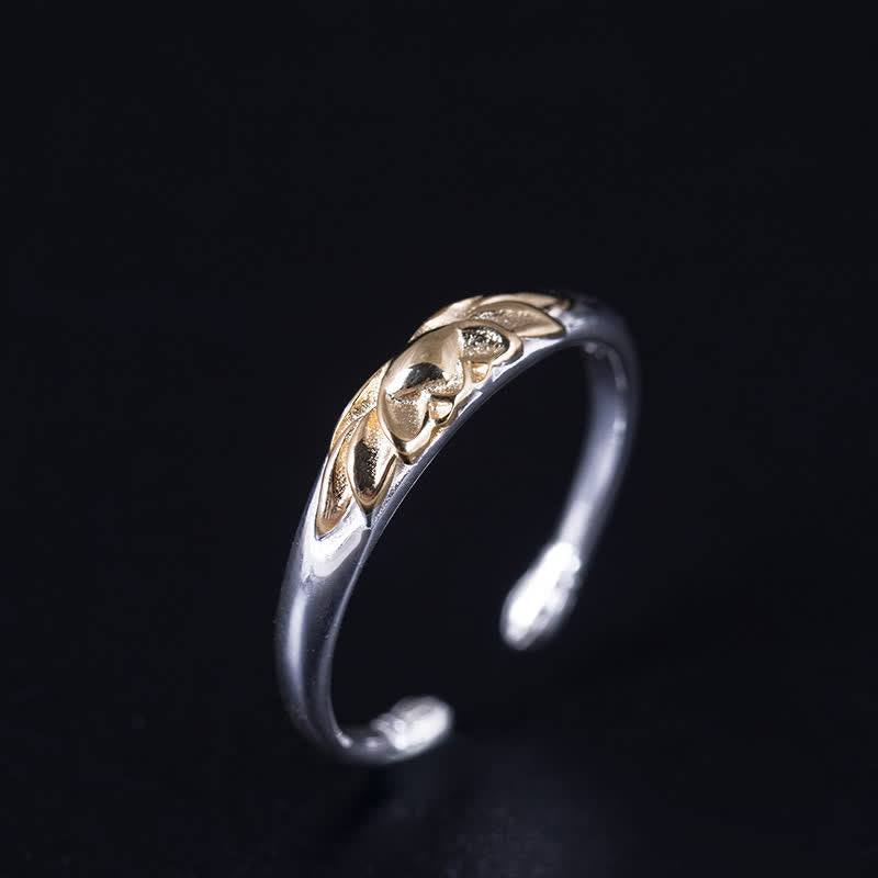 925 Sterling Silver Lotus Ring – Three-quarter view of two-tone lotus cuff ring on black, silver gold ring
