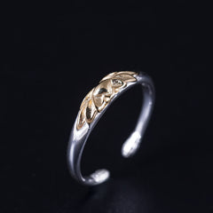 925 Sterling Silver Lotus Ring – Three-quarter view of two-tone lotus cuff ring on black, silver gold ring