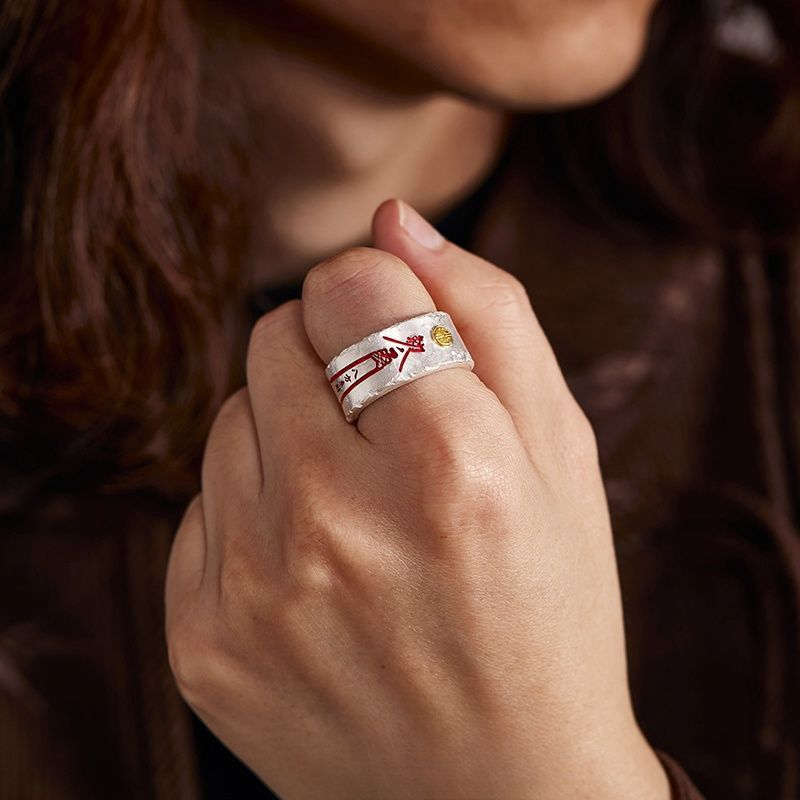 Tian Guan Ci Fu Ring – woman wearing silver band with red charm on finger, blessing protection amulet ring