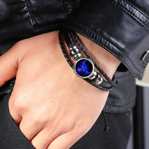 Zodiac Leather Wrap Bracelet – Scorpio worn on wrist with leather jacket, lifestyle close-up shot
