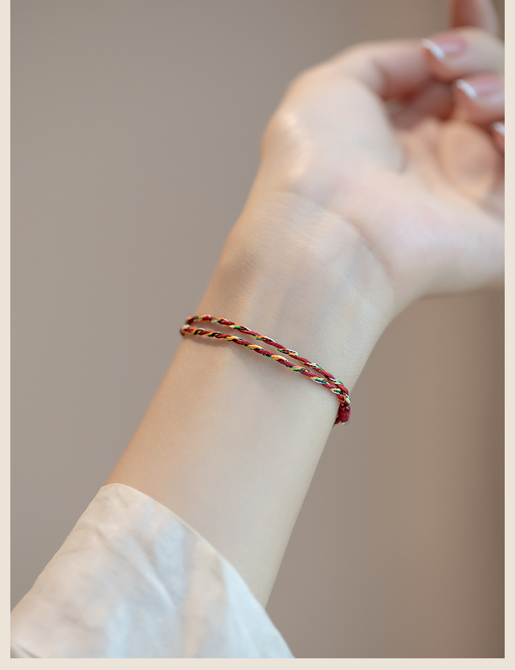 Koi Red String Bracelet – double-wrap multicolor cord on wrist showing side detail, minimalist fortune bracelet