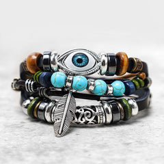 Tibetan Turquoise Evil Eye Bracelet – layered leather turquoise and wood beads with evil eye amulet close-up