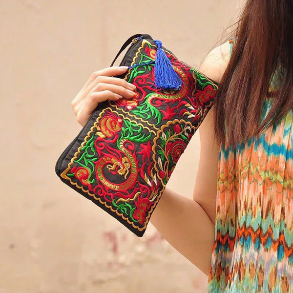 Dragon Butterfly Embroidery Wallet - 3/4 view of dragon clutch with blue tassel, Transformation