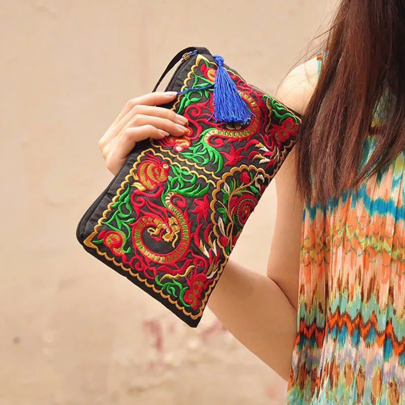 Dragon Butterfly Embroidery Wallet - 3/4 view of dragon clutch with blue tassel, Transformation