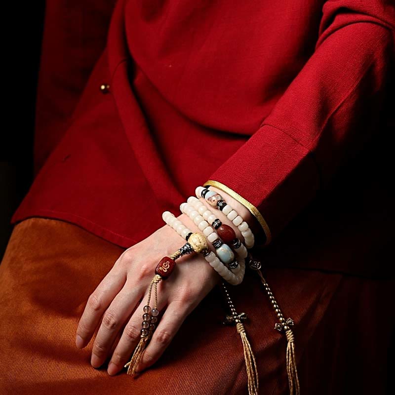 108 Mala Beads Bracelet – Multi-strand wrap with gold tassels on model