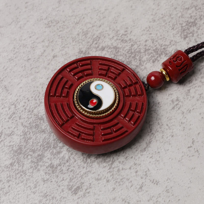 Cinnabar Bagua Rotatable Yin Yang Necklace – Cinnabar Bagua obsidian pendant side view, carved trigram detail