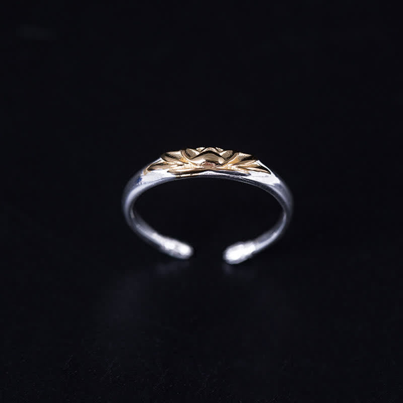 925 Sterling Silver Lotus Ring – Gold lotus flower centered on polished silver adjustable band, black backdrop