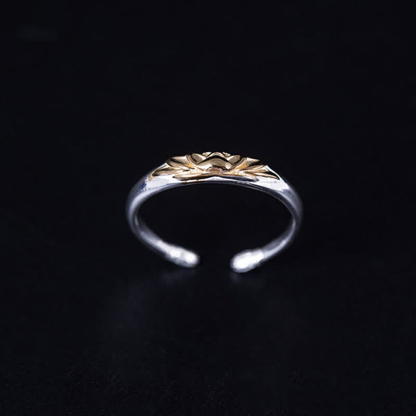 925 Sterling Silver Lotus Ring – Gold lotus flower centered on polished silver adjustable band, black backdrop