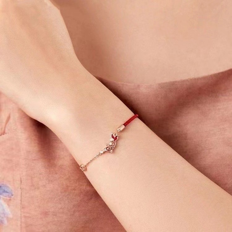 Shang An Koi Anklet – red string and rose gold chain worn on wrist, delicate koi charm with crystals, elegant accessory