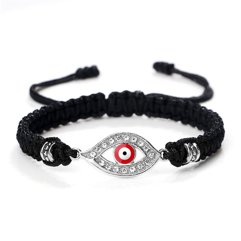 Black cord evil eye bracelet with silver red evil eye crystal pave charm on white bg