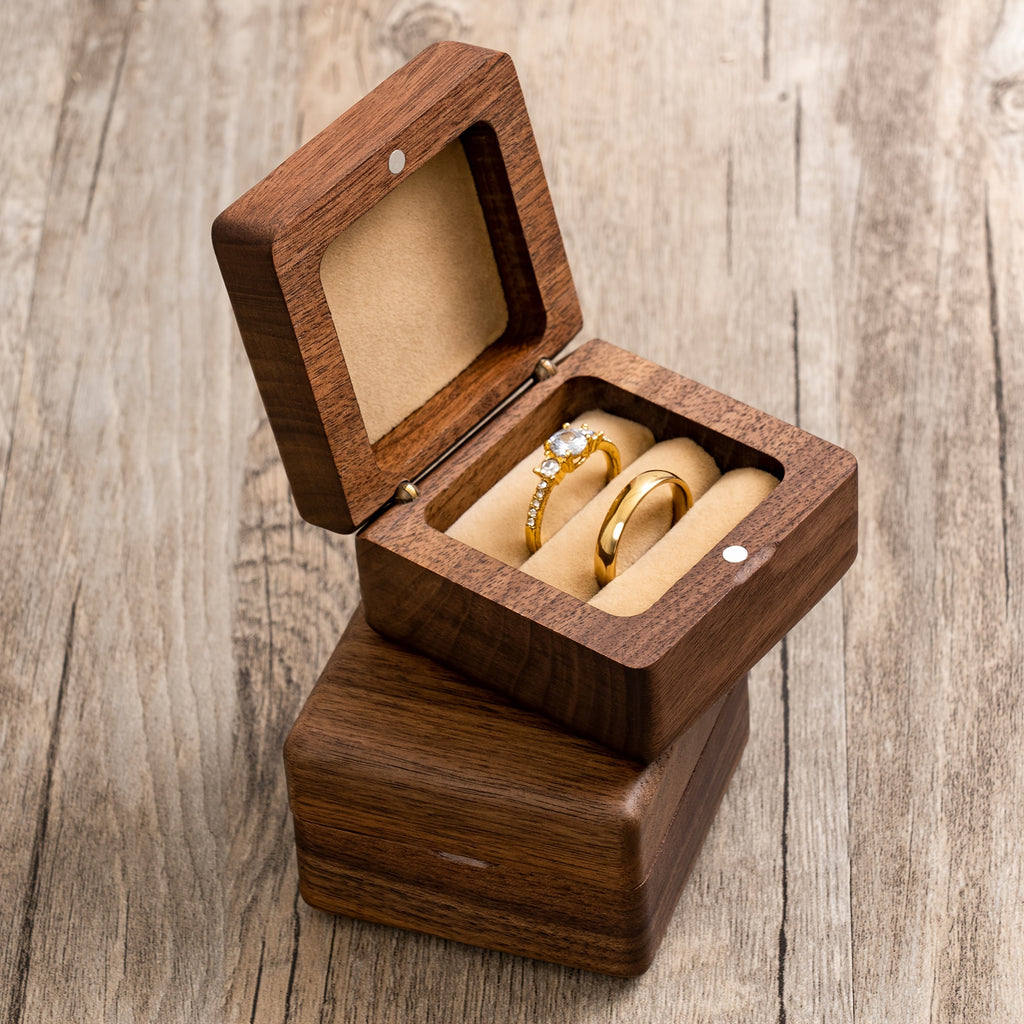 Walnut Wood Ring Box – handcrafted open box showing dual ring slots on rustic surface, artisan