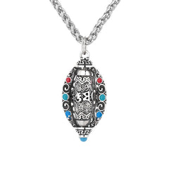 Tibetan Om Mani Padme Hum Pendant Necklace – Front view of silver pendant with mantra engravings and colored cabochon stones