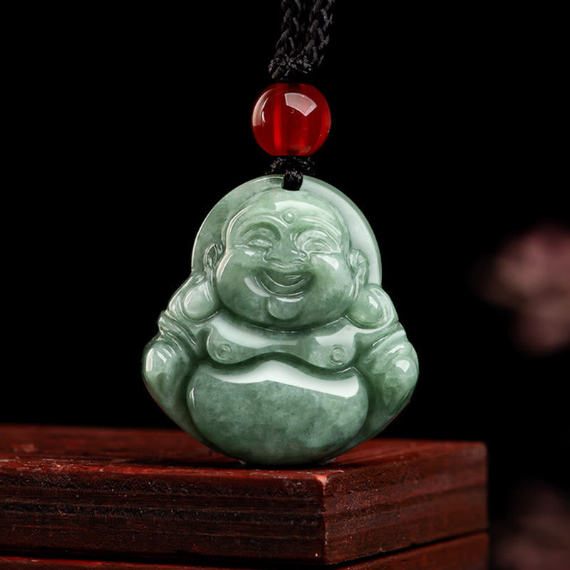 Green Jade Laughing Buddha Pendant - natural sage green jade with braided cord on wooden stand, front studio, Good Fortune