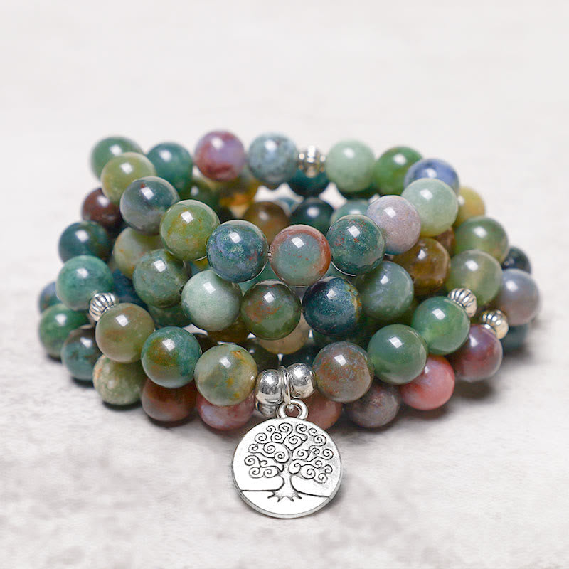 108 Mala Indian Agate Bracelet – coiled earthy agate mala with Tree of Life charm on marble background, gemstone jewelry