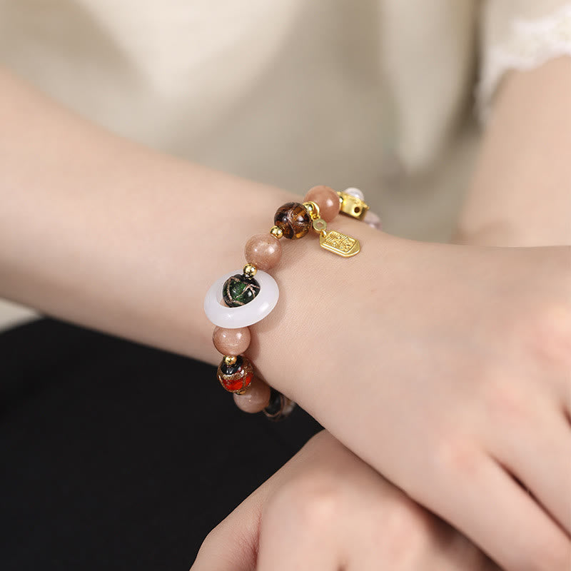 Liuli Glass Prayer Wheel Bracelet – Worn on wrist in natural light, fortune charm bracelet