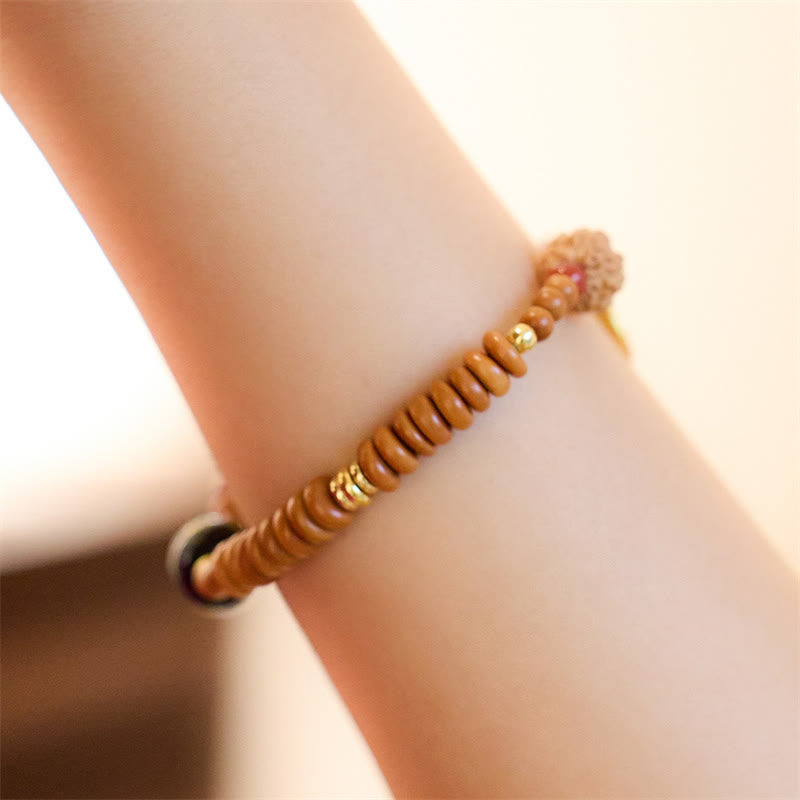 Bodhi Seed Bracelet – Side view showing gold spacer beads and dark focal bead, wrist jewelry