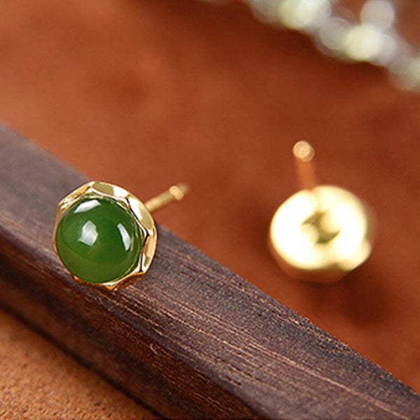 Hetian Cyan Jade Gold Plated Silver Stud Earrings single close-up on wood