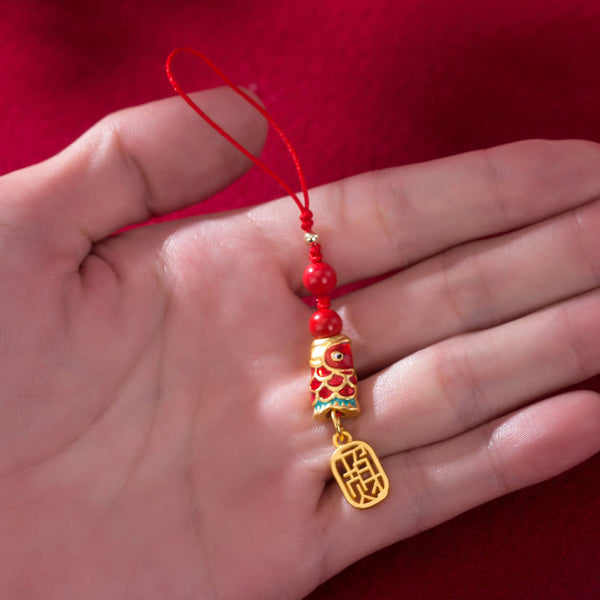 Koi Fish Cinnabar Ruyi Phone Charm – wrapped around wrist showing phone charm length, red koi ruyi cinnabar tassel
