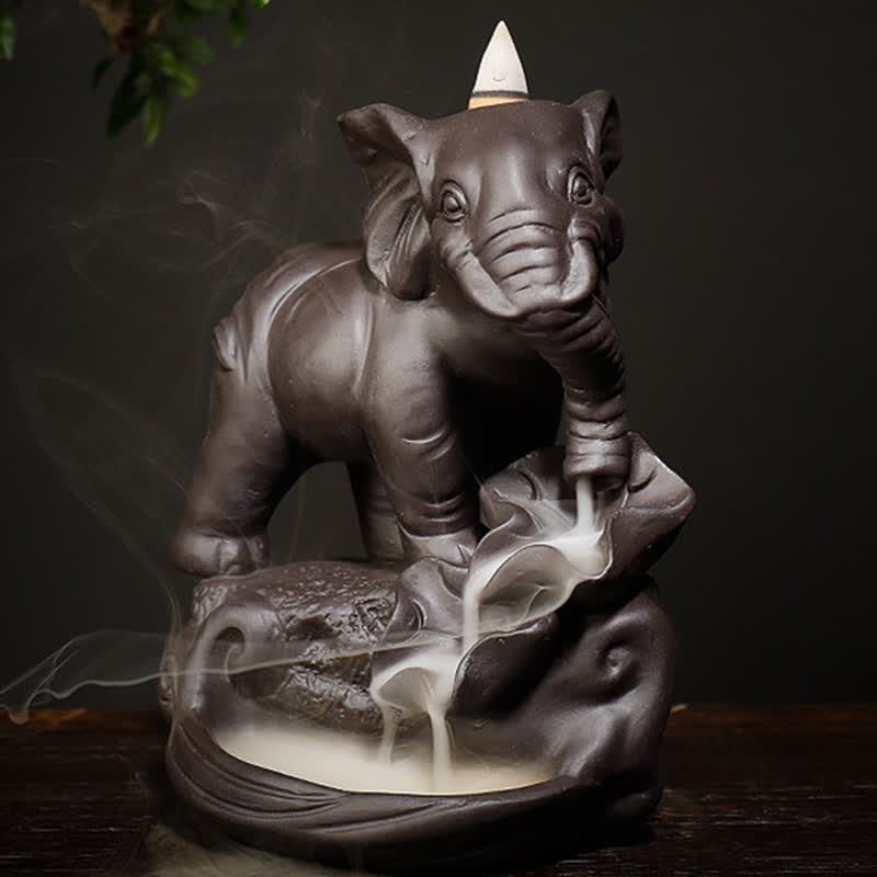 Elephant Backflow Incense Burner – Close front view with smoke waterfall effect on dark ceramic lotus base, zen home accent