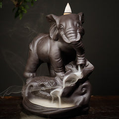 Elephant Backflow Incense Burner – Close front view with smoke waterfall effect on dark ceramic lotus base, zen home accent