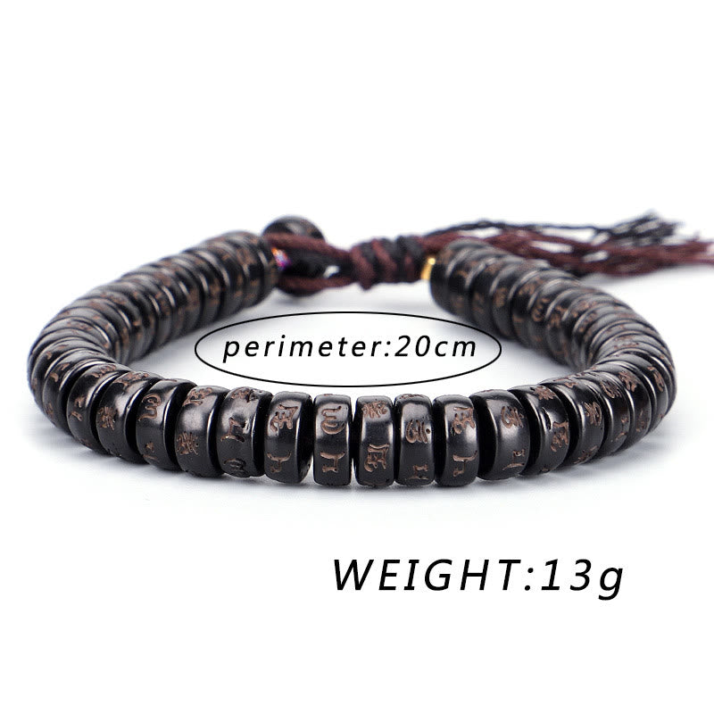 Coconut Shell Om Mani Padme Hum Bracelet – dark disc beads with engraved symbols on brown cord with knot closure, weight specs overlay