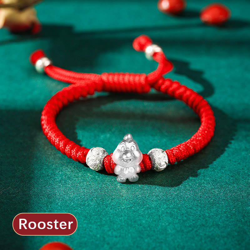 999 Sterling Silver Zodiac Red Rope Kids Bracelet - Silver dog charm on red cord on teal fabric, cute zodiac accessory