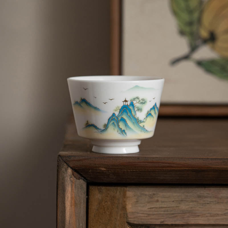 Ceramic Kung Fu Tea Cup – tea pouring into cup on bamboo tray, mountain decoration, gongfu ritual, amber tea