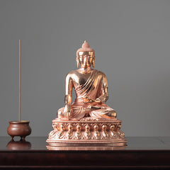 Shakyamuni Copper Statue – side profile showing Bhumisparsha mudra and robe folds, copper craft detail